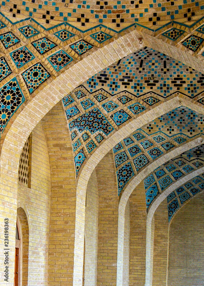Intricate colorful mosaic tiles adorn a series of arches at the Vakil Mosque in Shiraz, in the Fars province of southern Iran