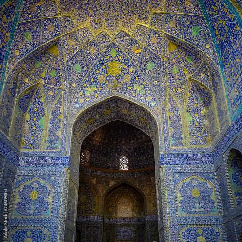 A tall arch decorated with intricate blue mosaic artwork  at the UNESCO listed Imam Mosque  in Esfahan  Iran