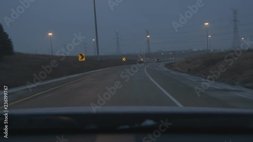 Driving on wet, winter evening. Off-ramp from Express Toll Route Highway 407, merging with Hwy 404 going south in Toronto, Canada. photo