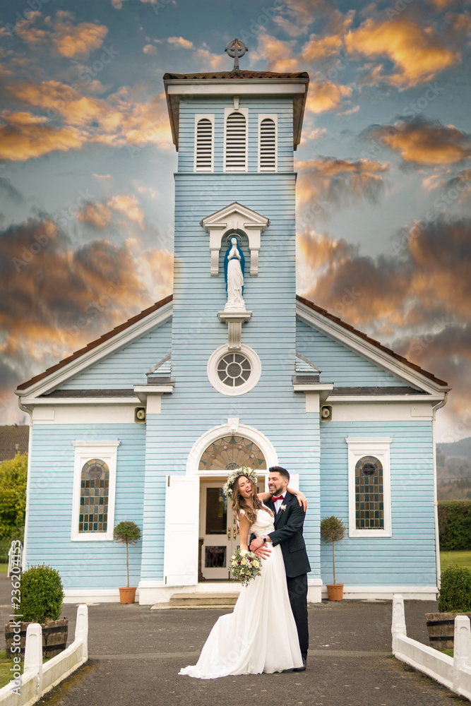 young couple bride groom getting married wedding posed photos at seaside sea beach hairpiece flowers bouquet church