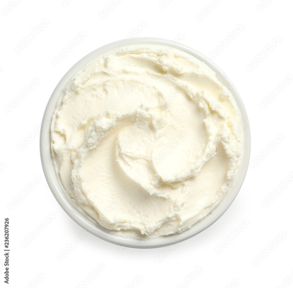 Bowl of tasty cream cheese on white background, top view Bowl of tasty cream cheese on white background, top view