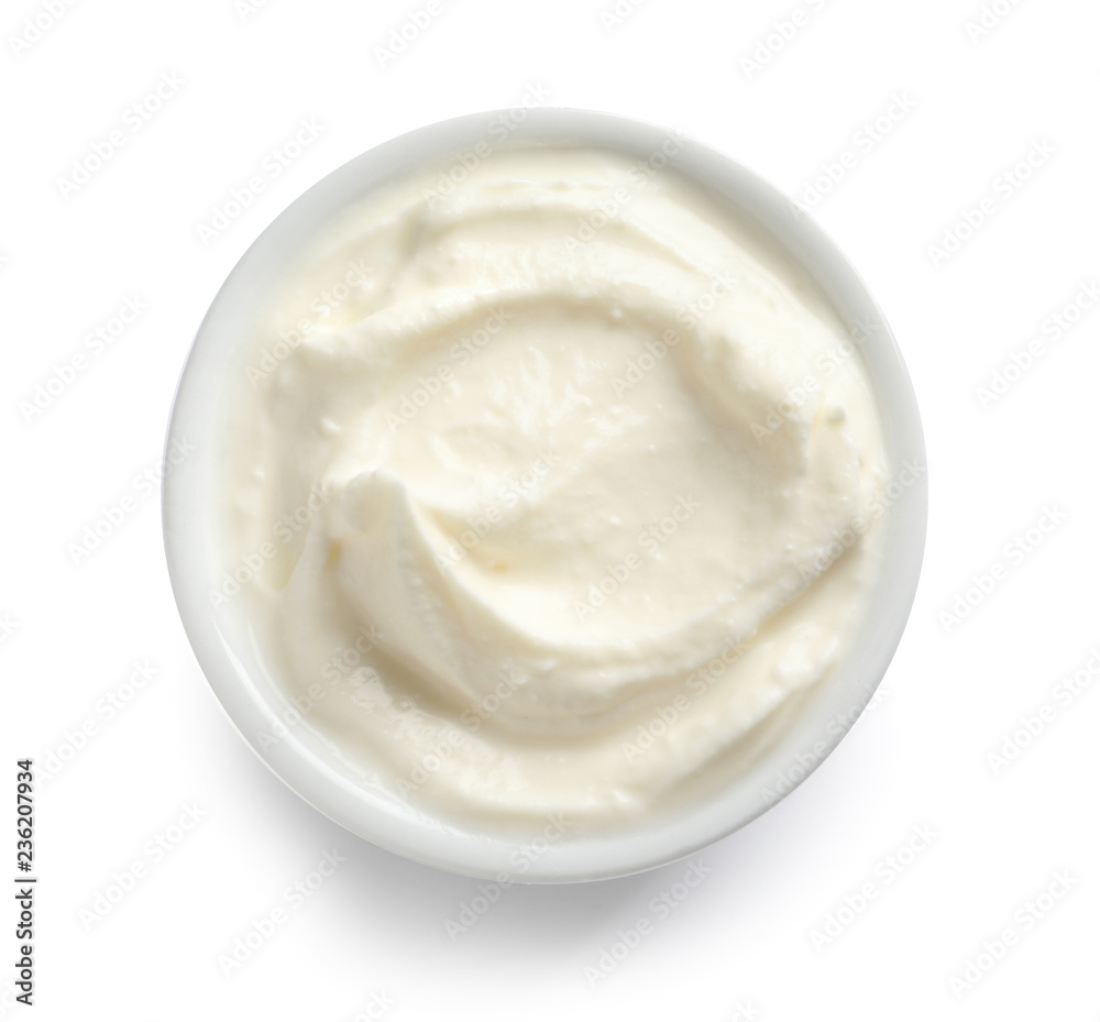 Bowl of tasty cream cheese on white background, top view Bowl of tasty cream cheese on white background, top view