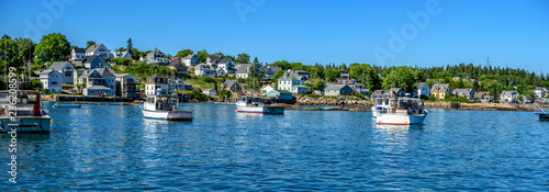 Maine Lobster Boats Anchored in a Bay in Front of a Quaint New England Village