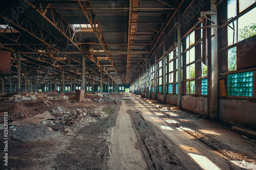 Ruins of abandoned factory or warehouse, large creepy and empty industrial constriction