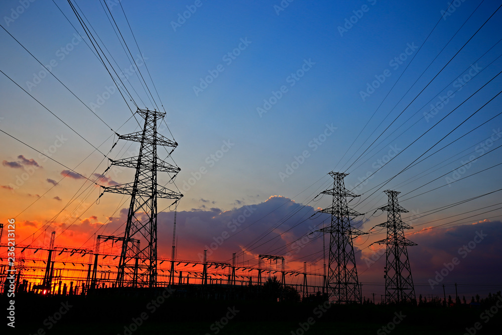 Fototapeta premium Electric tower, silhouette at sunset