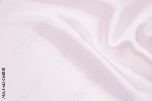 The texture of the satin fabric of lilac color for the background