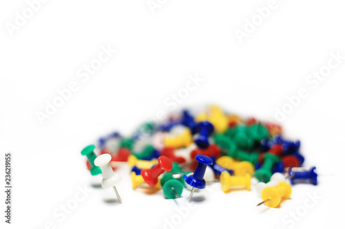 Colorful pushpins isolated in white background. Office accessories with copy space.