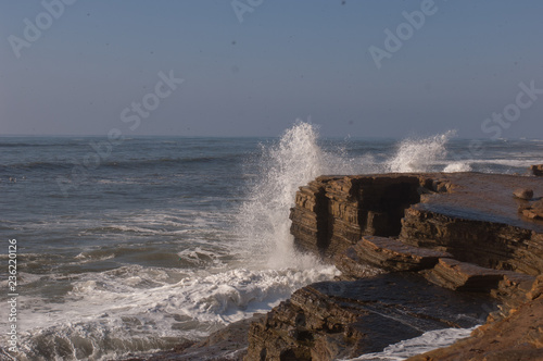 wave crashing on rocks