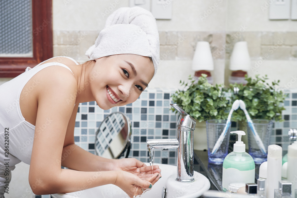 Woman washing face Woman washing face