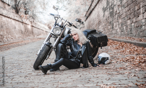 Beautiful woman with motorcycle outdoor. 