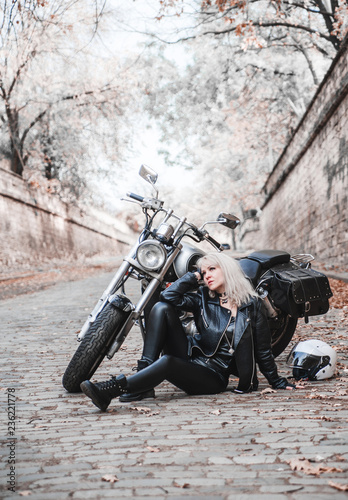 Beautiful woman with motorcycle outdoor. 