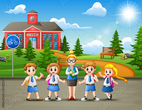 Happy school children in the road to school