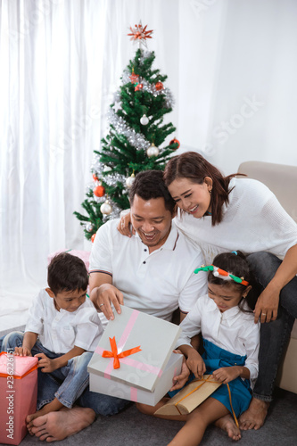 family gift exchange during christmas photo