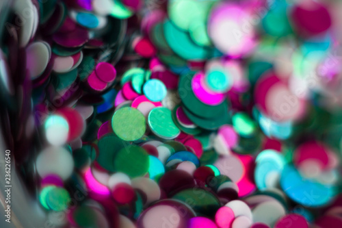 Blurred round bokeh lights of red and blue background for celebrating Christmas and New Year's party at night. Colorful bokeh background. Glitter blurry lights