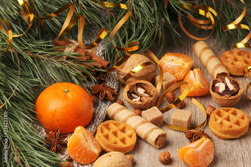 Still life formed with pine branches and New Year sweets
