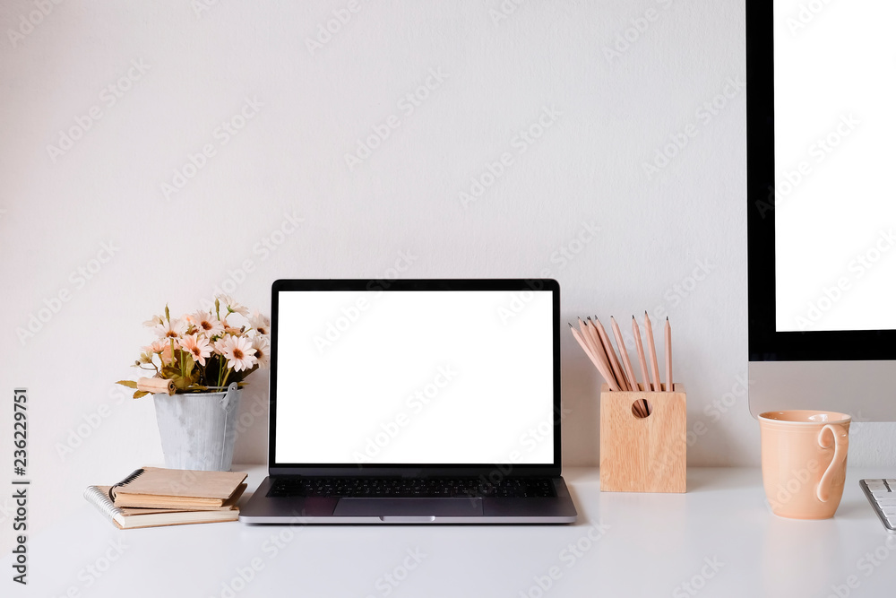 Workplace mockup concept. Mock up home decor desktop computer and laptop with vintage books, flower. Copy space for products display montage.Mockup desktop. Workplace mockup concept. Mock up home decor desktop computer and laptop with vintage books, flower. Copy space for products display montage.Mockup desktop.