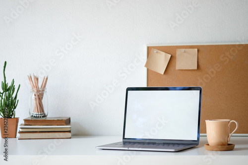 Workplace mockup concept. Selective focus Mockup home decor laptop computer and office object with copy space for products display montage.Mockup desktop © Prathankarnpap