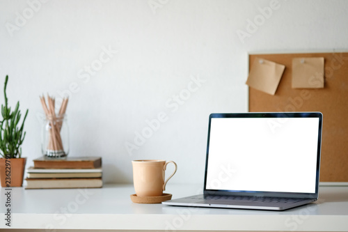 Workplace mockup concept. Selective focus Mockup home decor laptop computer and office object with copy space for products display montage.Mockup desktop