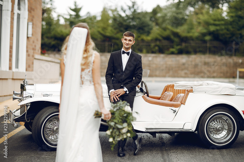 Couple near old car