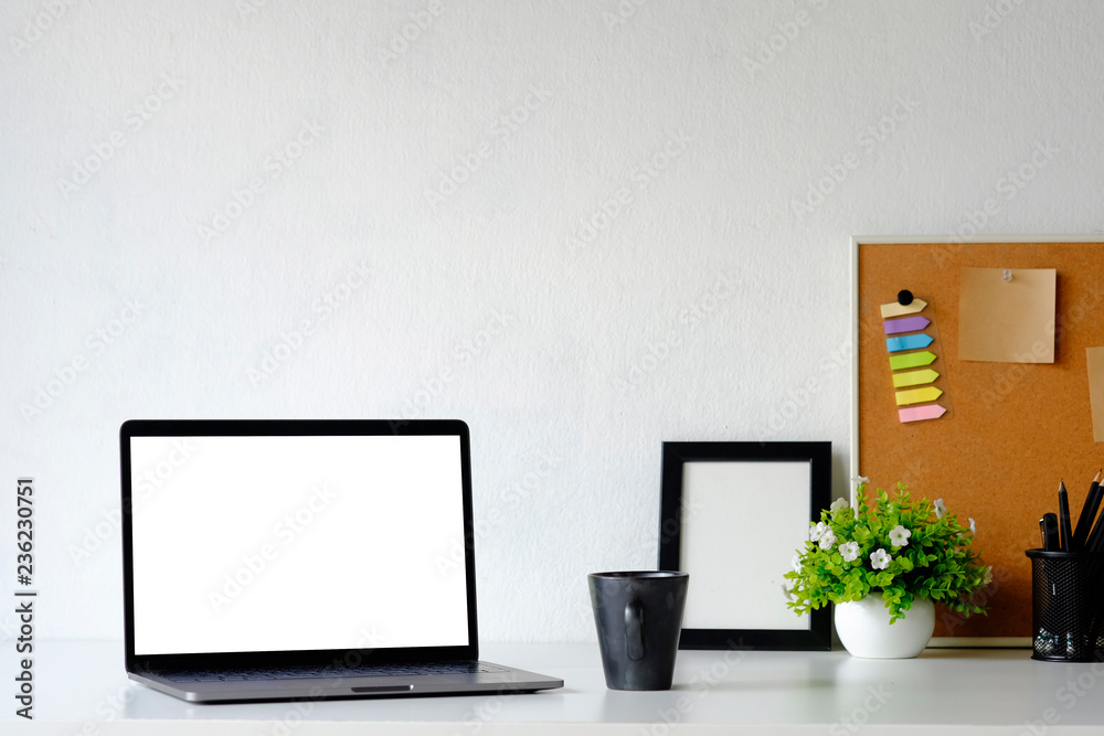 Mockup laptop computer on office table with office supplies. Mockup laptop computer on office table with office supplies.