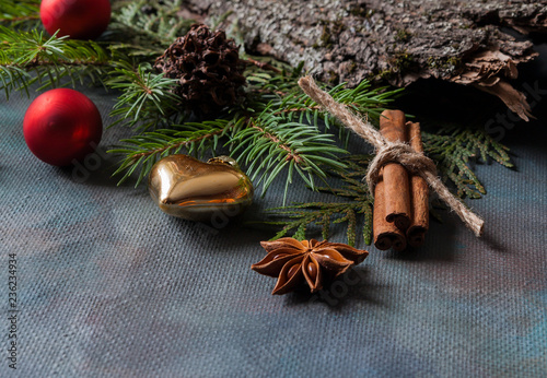 Happy Christmas. The concept of postcards, Christmas greetings, Christmas articles. Christmas cinnamon, tree branches, anise, cones. Close up. Selective focus. Copy space.