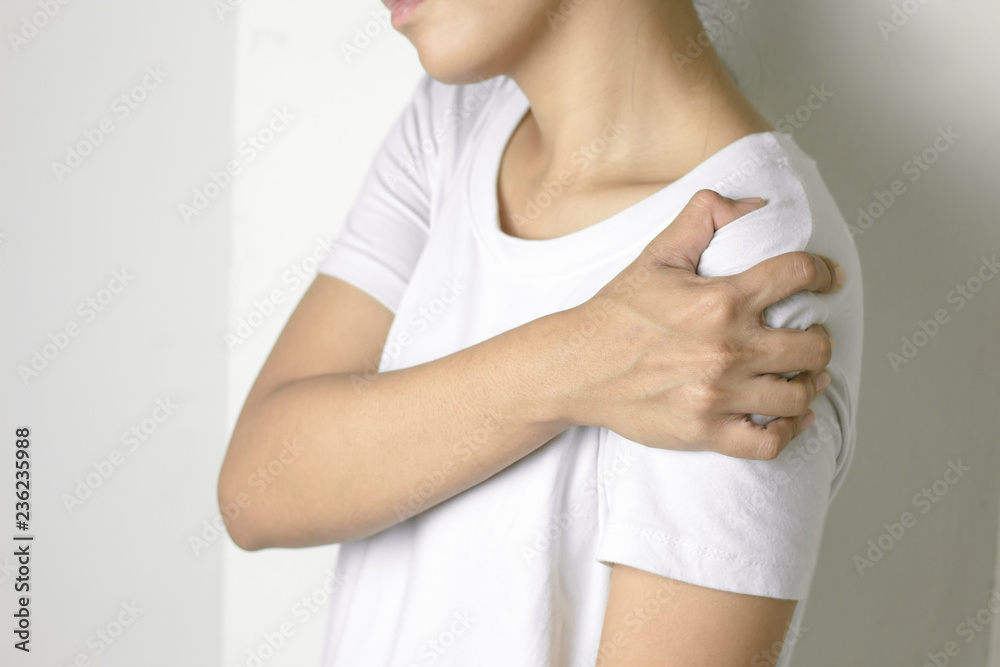 Woman with pain in shoulder. Woman with pain in shoulder.