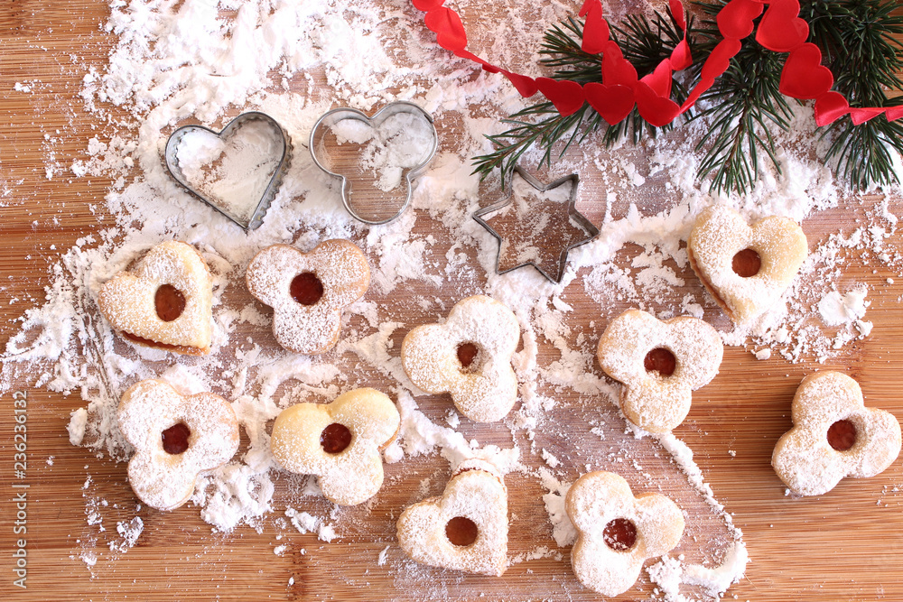 Home made baked Christmas cookies as a gift for family and friends on wooden table. Traditional in Europe .Blurred background.Holiday concept. Home made baked Christmas cookies as a gift for family and friends on wooden table. Traditional in Europe .Blurred background.Holiday concept.