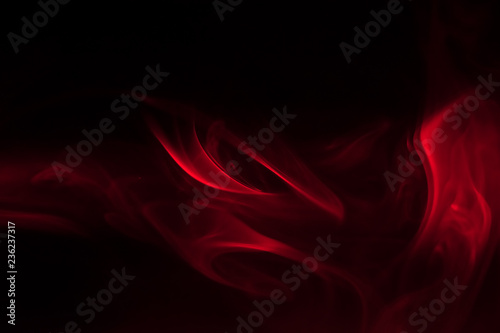 red smoke (evaporation) on a black background