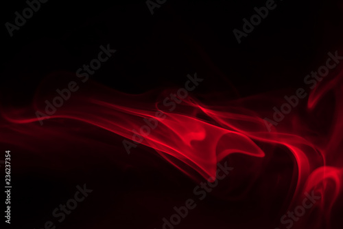 red smoke (evaporation) on a black background