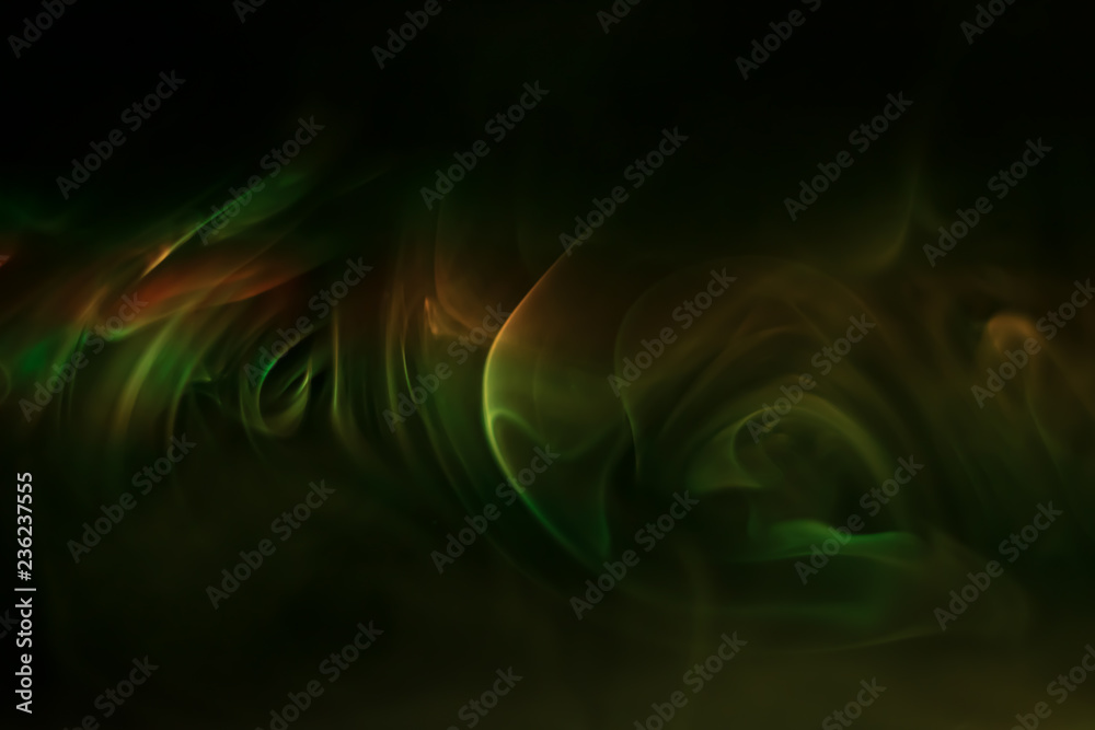 Fototapeta premium Yellow, green smoke (evaporation) on a black background