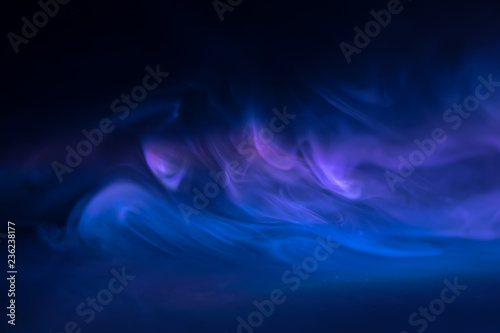 purple, blue, pink smoke (evaporation) on a black background