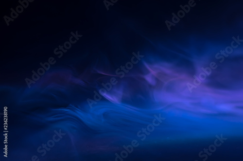 purple, blue, pink smoke (evaporation) on a black background