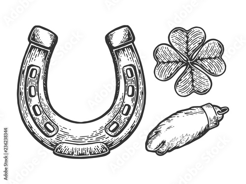 Luck talisman objects horseshoe clover rabbit paw engraving vector illustration. Scratch board style imitation. Black and white hand drawn image.