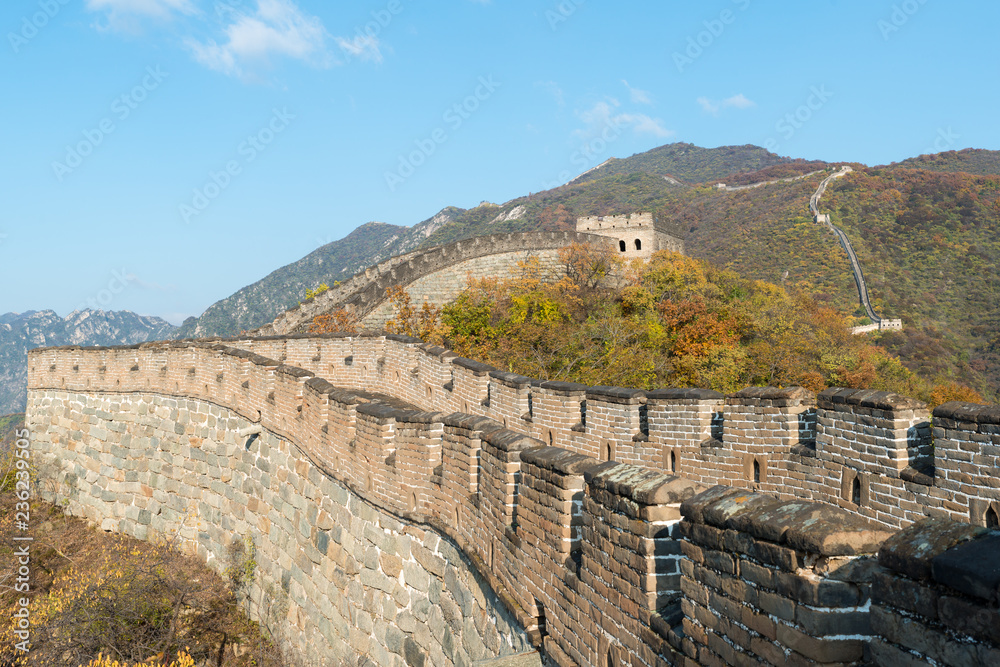 China The great wall distant view compressed towers and wall segments autumn season in mountains near Beijing ancient chinese fortification military landmark in Beijing, China.