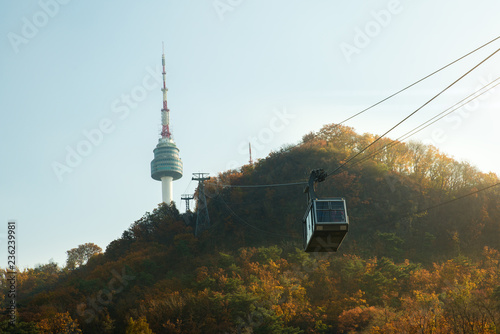 Namsan N Seoul Tower with the line of cable car at the sunset time in autumn at Seoul, South Korea..