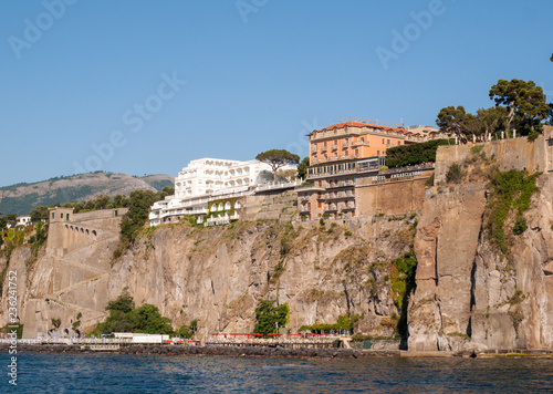  View of houses and hotels on the cliffs in Sorrento. Gulf of Naples, Campania, Italy