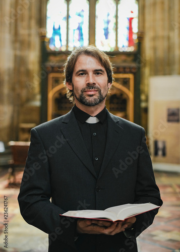 Bilde på lerret Christian priest standing by the altar