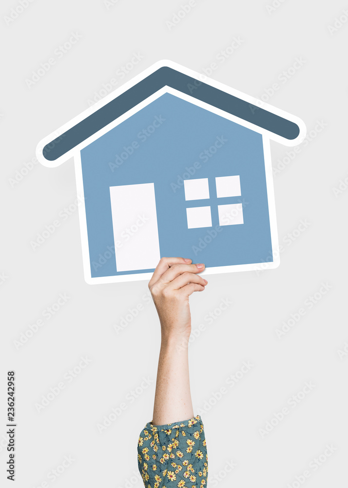 Hand holding a house cardboard prop - obrazy, fototapety, plakaty 