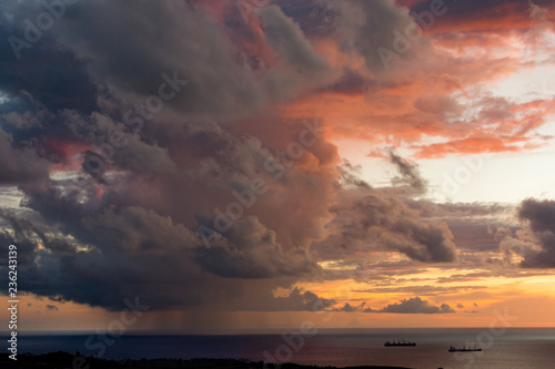 Magnificent colored clouds on the sea at sunset in the evening © Gao