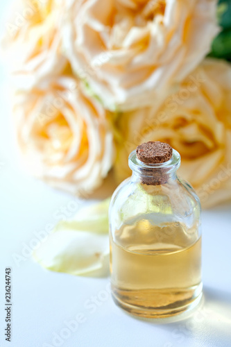 Glass jar with rose water and aromatherapy, copy space for text.