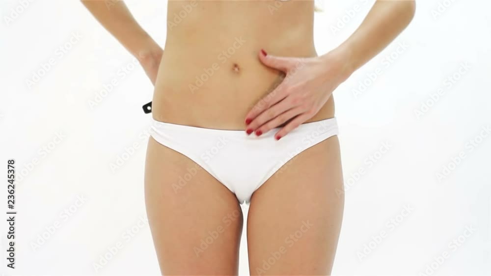 woman analyzing cellulite on her buttocks