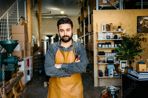 Portrait of man standing in coffee shop