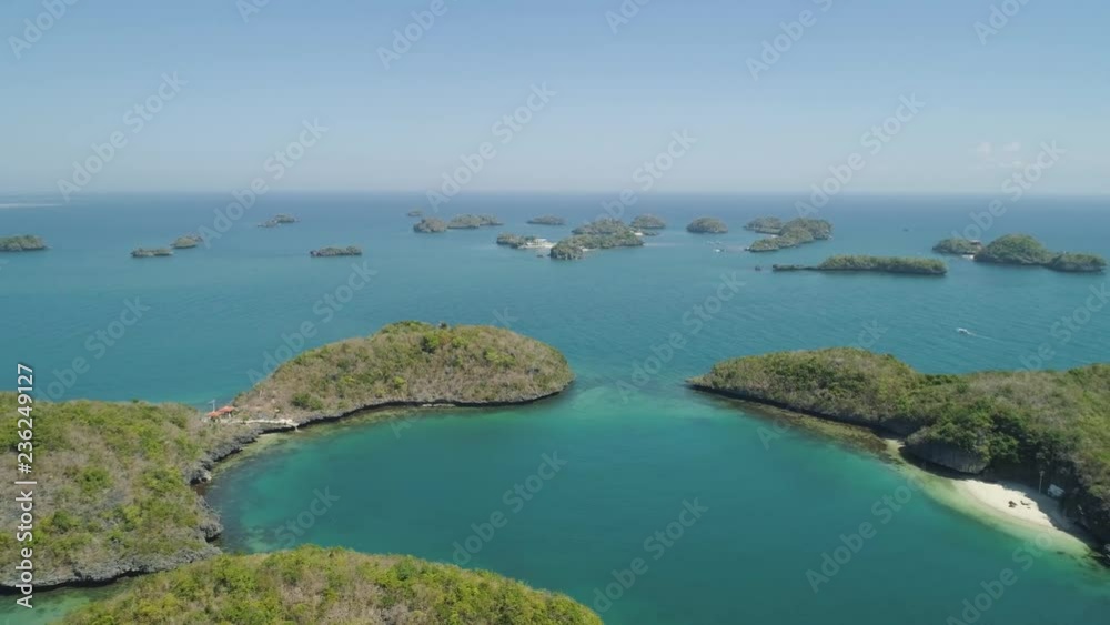 Aerial view of Small islands with beaches and lagoons in Hundred Islands National Park, Pangasinan, Philippines. Famous tourist attraction, Alaminos.
