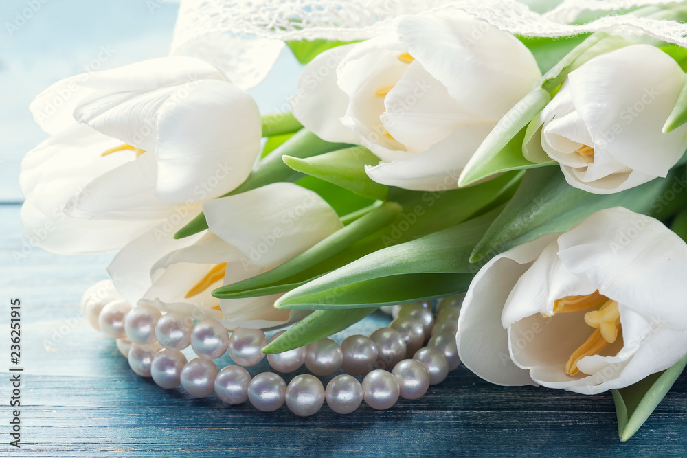 bouquet of white tulips on a wooden background