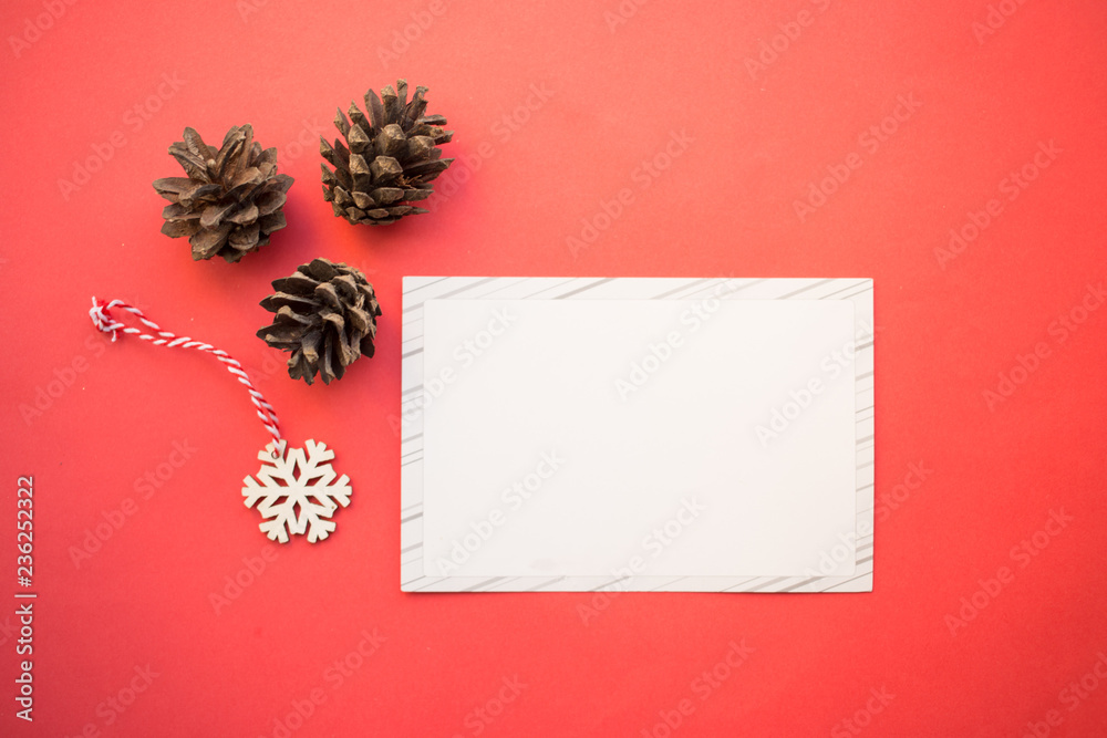 Pine cones, snowflake, greeting card, Festive christmas decoration on the red background ,copy space Pine cones, snowflake, greeting card, Festive christmas decoration on the red background ,copy space