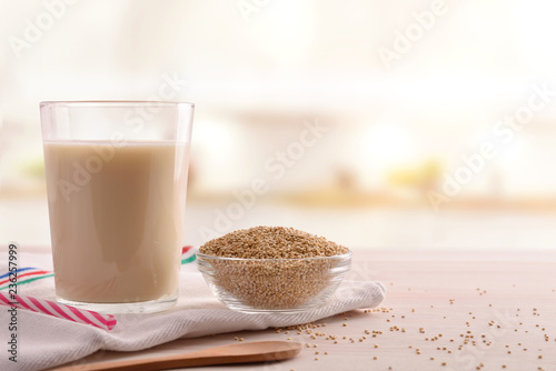 Quinoa drink and cereal grains in bowl in a kitchen
