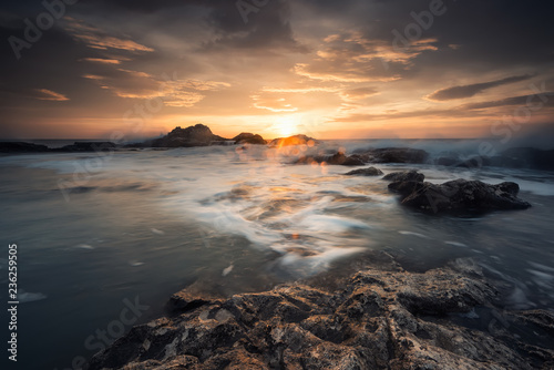 Sunrise on a rocky beach   Magnificent sea sunrise at the rocky Black sea coast