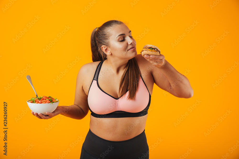 Portrait of a cheerful overweight fitness woman Portrait of a cheerful overweight fitness woman