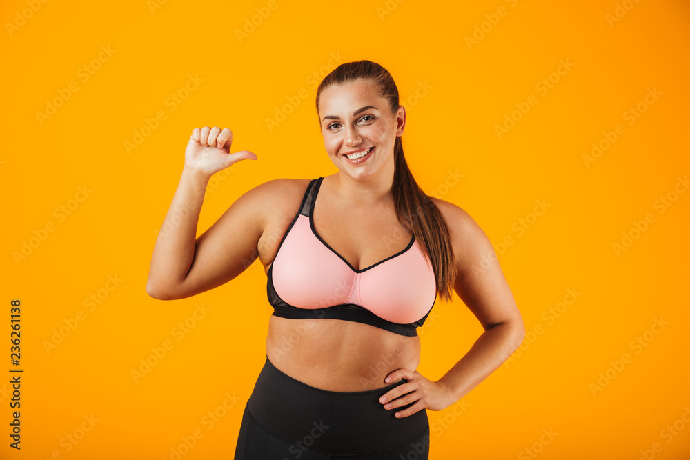 Portrait of a cheerful overweight fitness woman Portrait of a cheerful overweight fitness woman