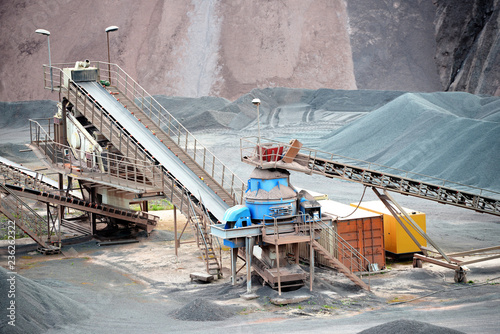 stone crusher in a quarry mine of porphyry rocks. photo